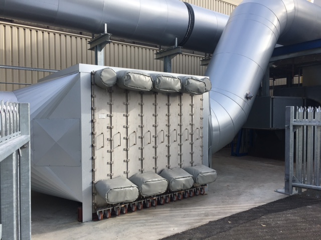Regenerative thermal oxidizer installed showing large ductwork at installation site.